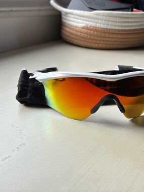 Oakley White Frame Sunglasses with Orange-Red Mirrored Lens